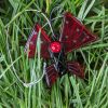 Red, glass butterfly ornament.